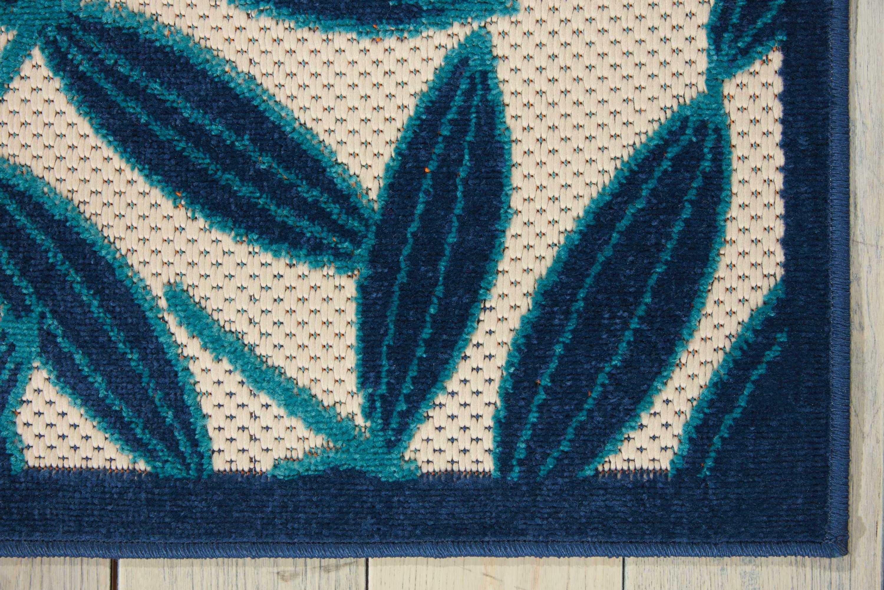 8' X 11' Navy Blue And Ivory Palm Leaf Indoor Outdoor Area Rug