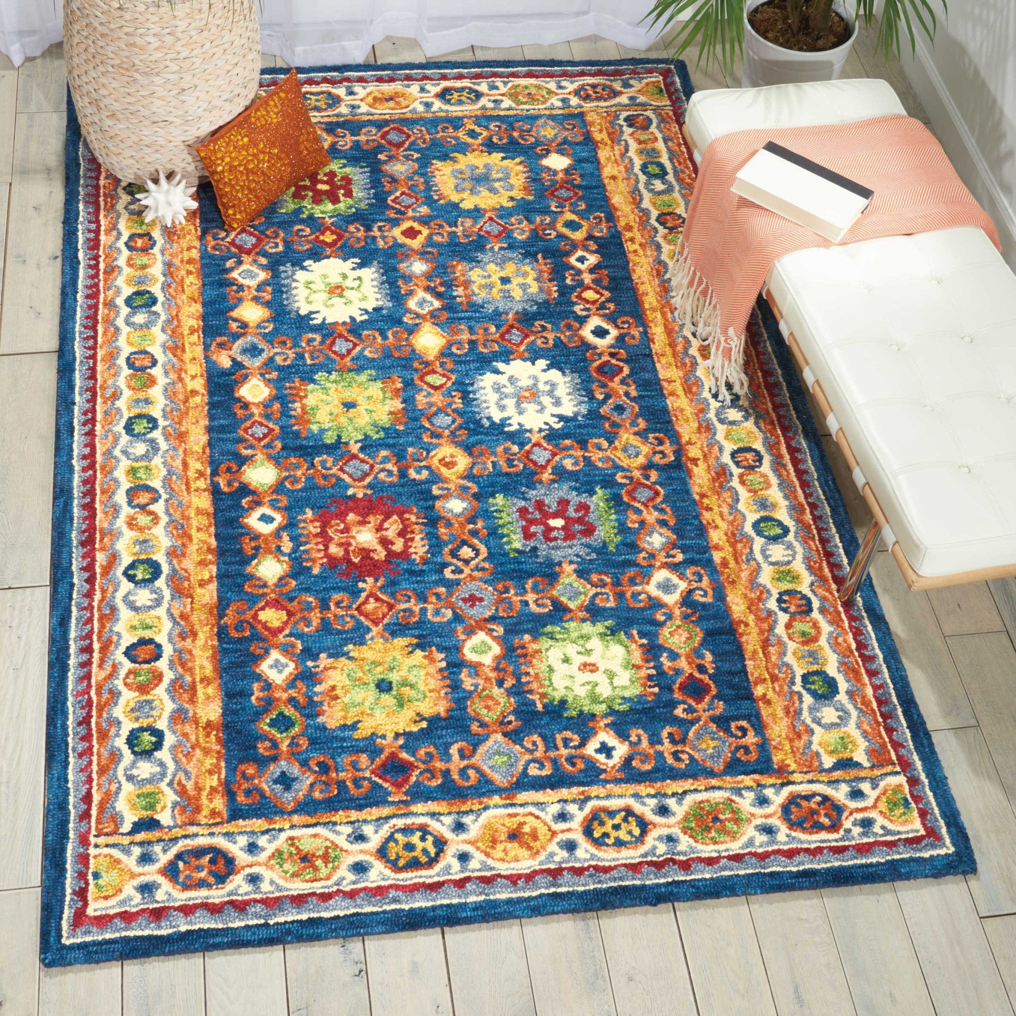 5' X 8' Navy Blue Orange And Green Wool Floral Hand Tufted Distressed Area Rug